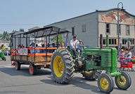 Steve Schuh drives his tractor in a parade