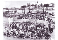 Old black and white photo of people from La Conner posing by waterfront.