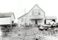 Black-and-white photograph of a dairy creamery building in 1908